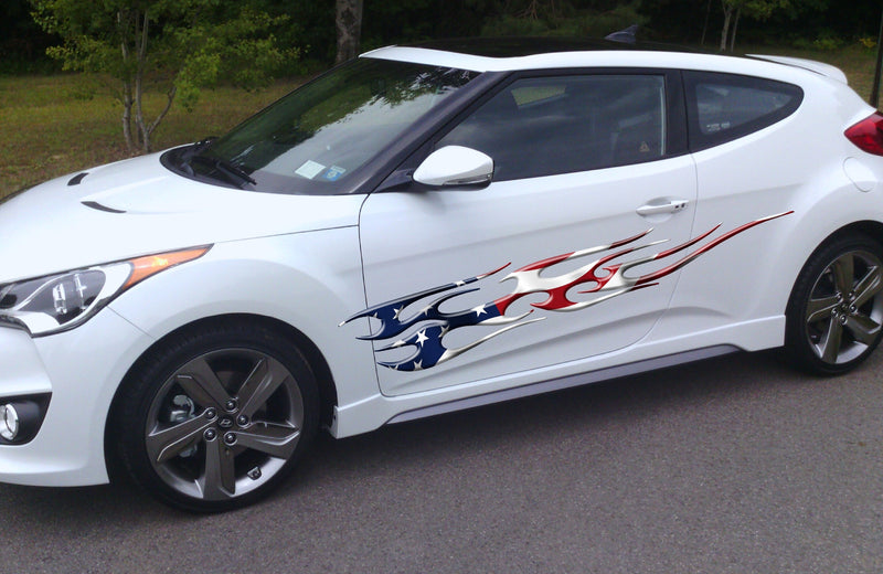 American flag flame graphics on white hatchback car